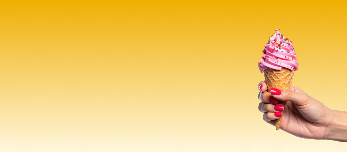 Hand holding a waffle cone with pink soft serve ice cream topped with sprinkles, against a yellow gradient background.